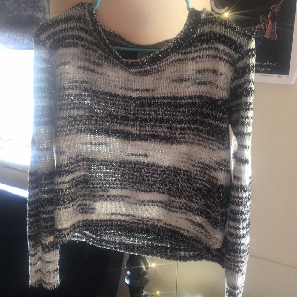 A black and white patterned sweater